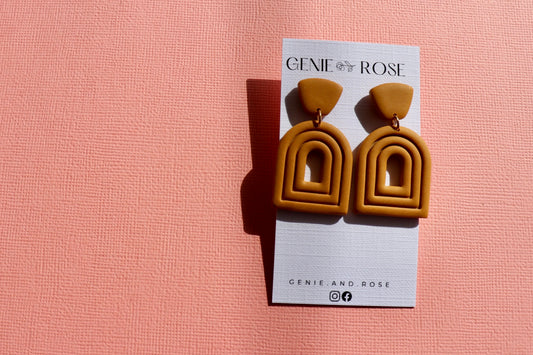 Extruded arch statement earring in spicy mustard