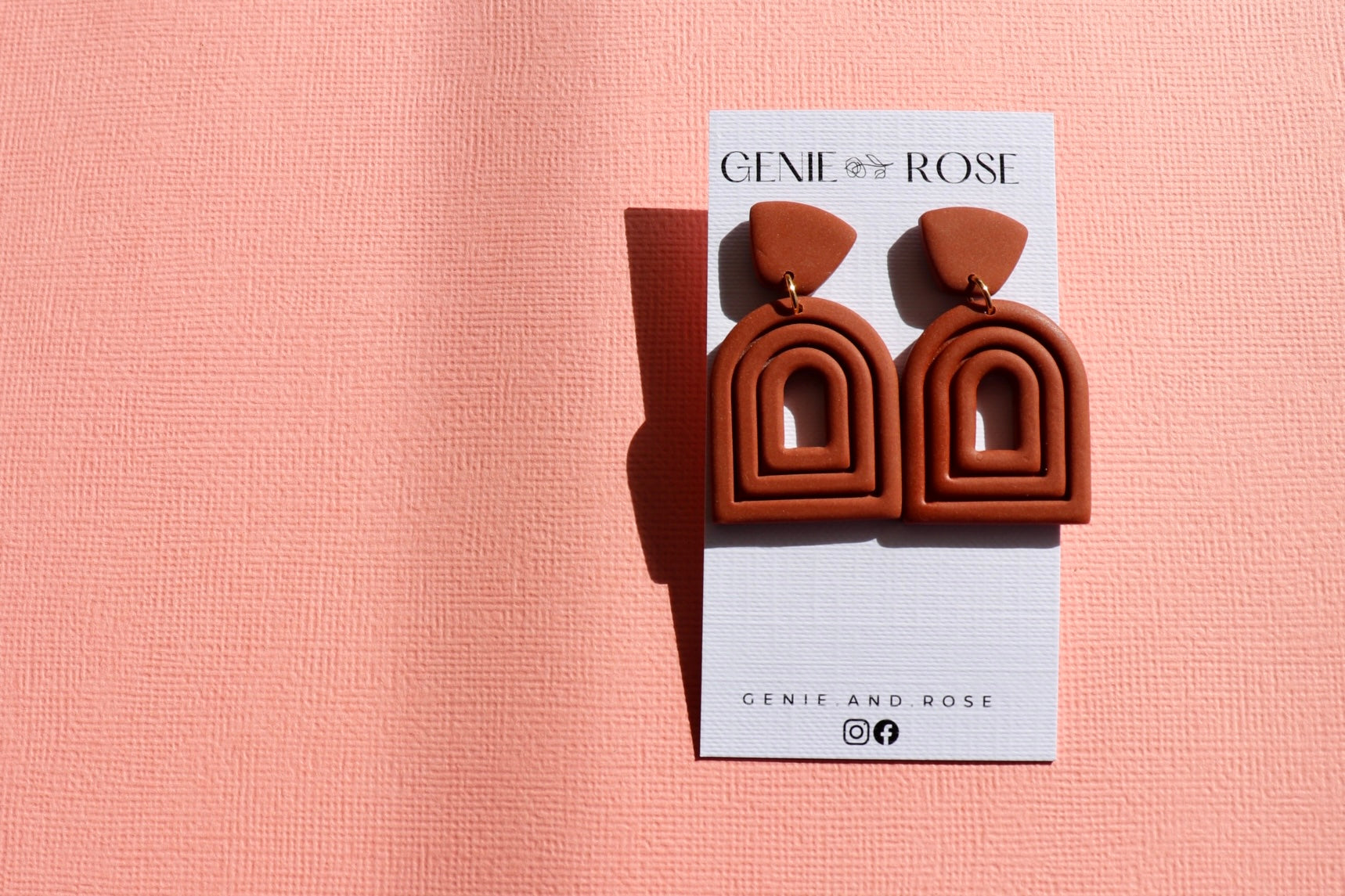 Extruded arch statement earring in leather