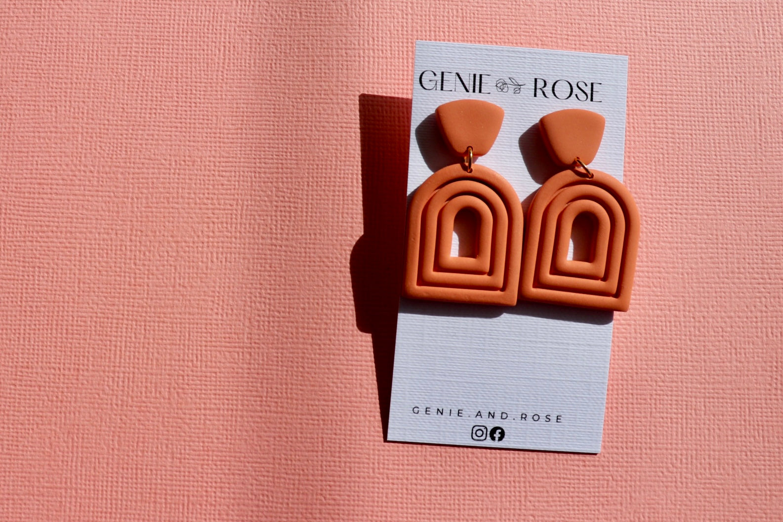 Extruded arch statement earring in coral