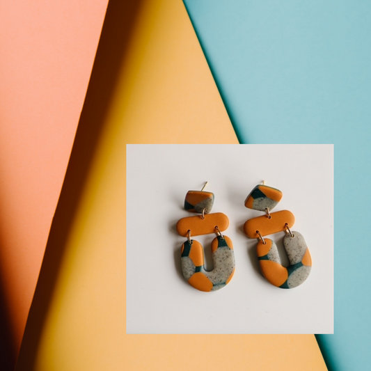 multi-colour statement earrings in dark teal, mustart, and granite. 